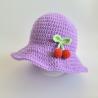 Thumbnail for Gehaakte baby hoedje twee-in-een | Lila met kersjes en oranje bloemetje