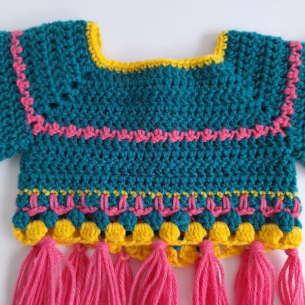 Gehaakt baby vestje | Petrol, roze en geel met roze franjes