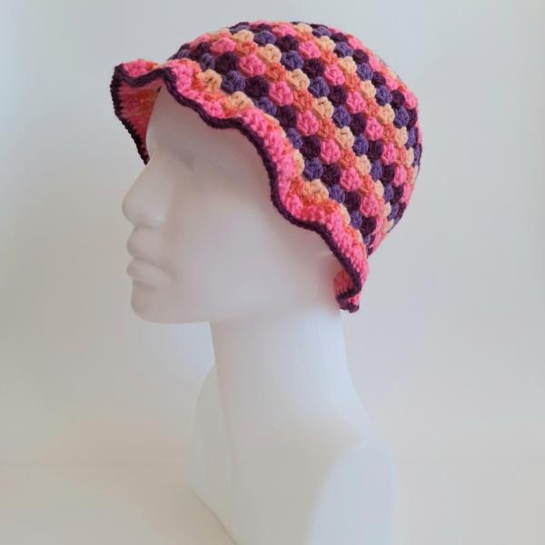 Gehaakte bucket hat | Pasteloranje, koraaloranje, Barbie roze, aubergine paars en paars