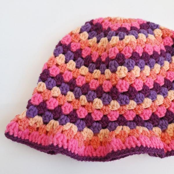Gehaakte bucket hat | Pasteloranje, koraaloranje, Barbie roze, aubergine paars en paars