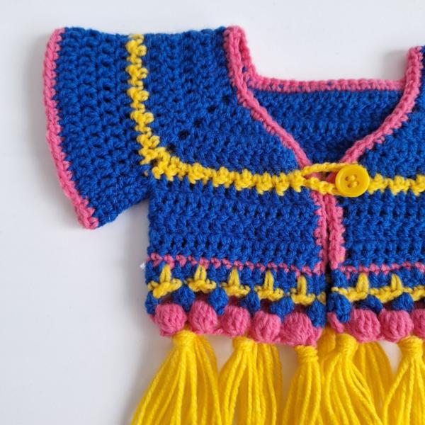 Gehaakt baby vestje | Blauw, roze en geel met gele franjes
