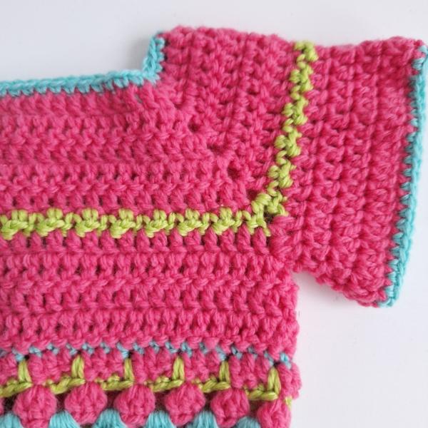 Gehaakt baby vestje | Roze, turquoise en groen met groene franjes