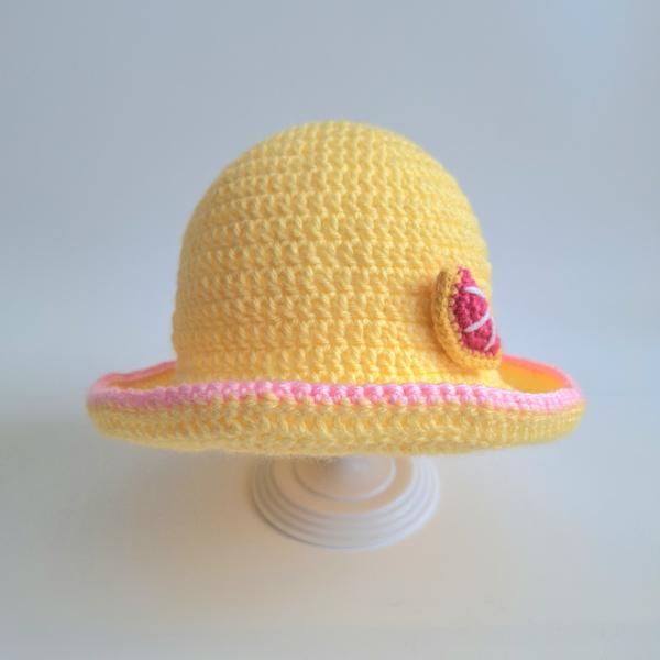 Gehaakt baby hoedje twee-in-een | Geel en lichtroze met bloemetje en grapefruit