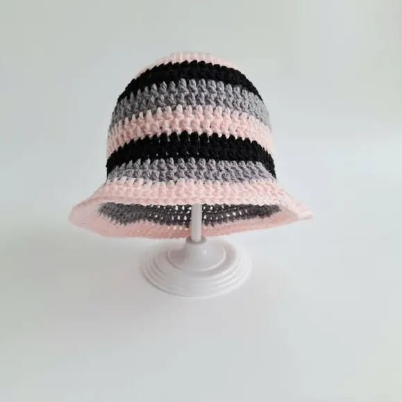 Photo by Britt Silas on November 27, 2025. May be an image of hat, crochet and text.