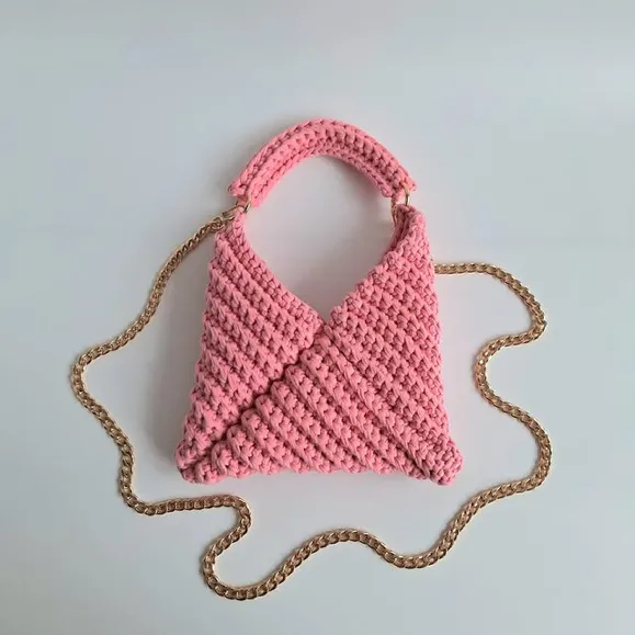 Photo by Britt Silas on January 13, 2026. May be an image of macrame, potholder, drawstring, crochet, pouch, grocery bag and text.