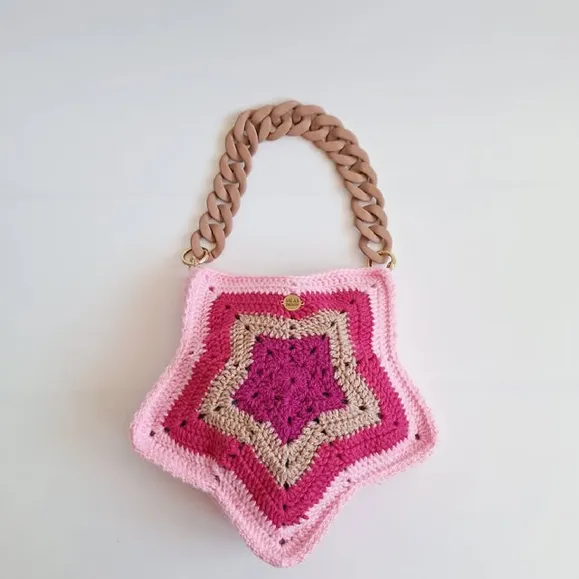 Photo by Britt Silas on February 28, 2026. May be an image of grocery bag, potholder, crochet, pouch and text.